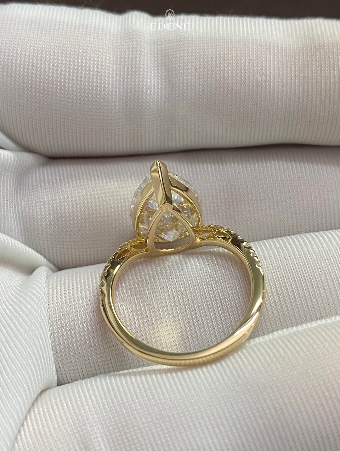 A fresh take on the timeless pear solitaire, styled with a gentle curved band for extra elegance (2)